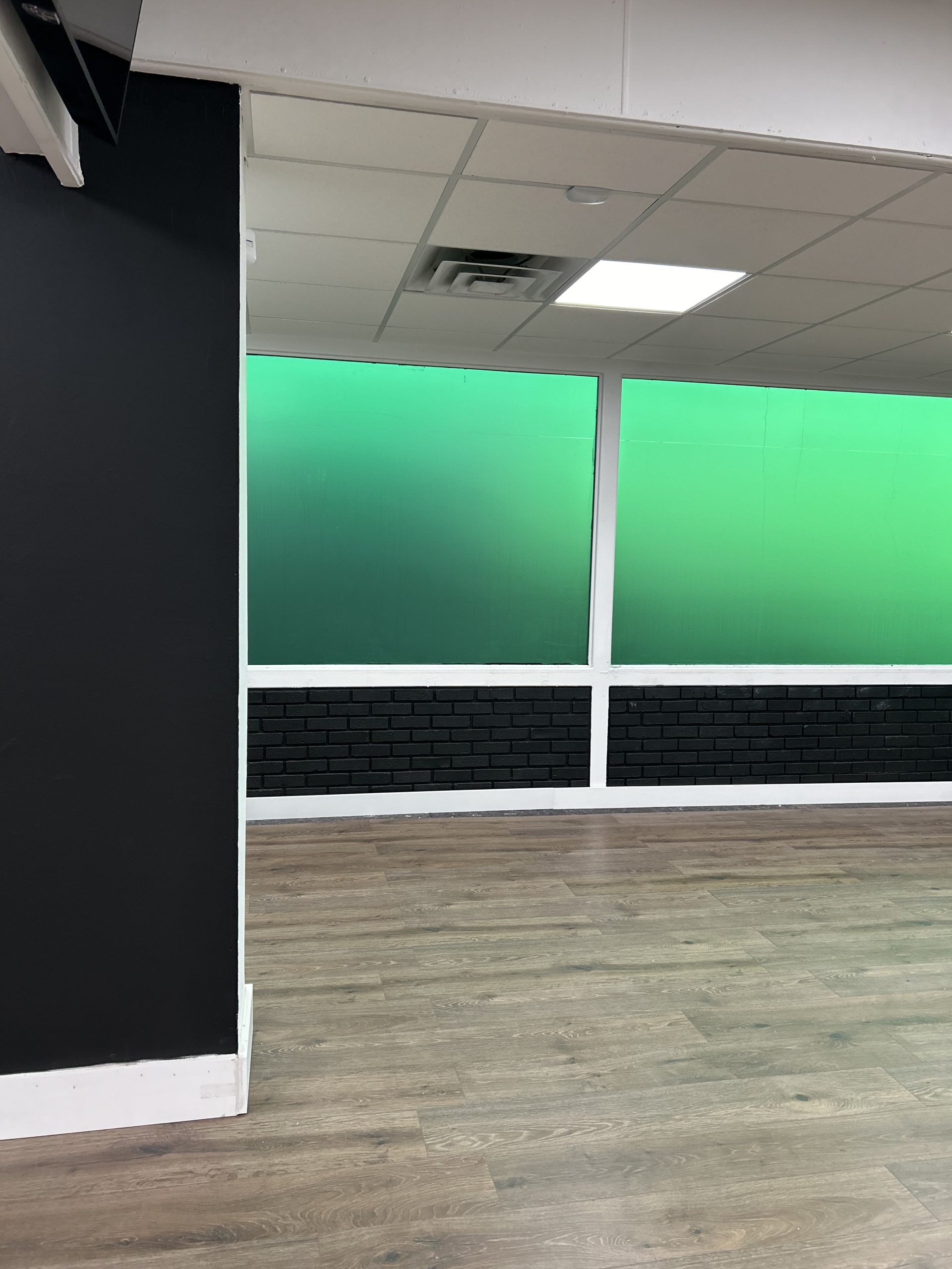 Interior green decorative privacy panels at Green Initiative Dispensary Wenonah
